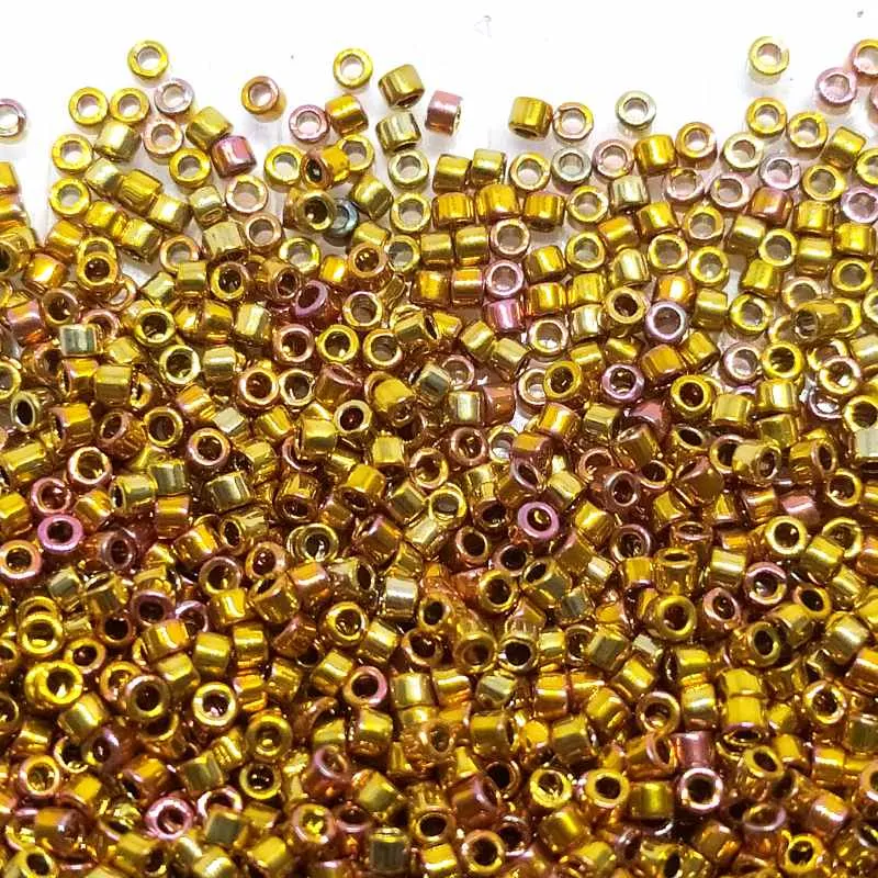 11/0 MIYUKI delica DB0501 - 24 kt. Tono oro Iris - 1gr.
